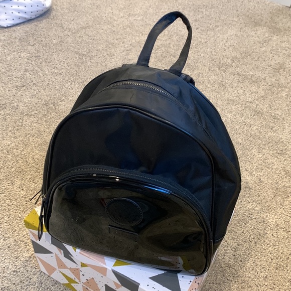 Black backpack. Medium sized. Not very small and not very big. - Picture 2 of 3